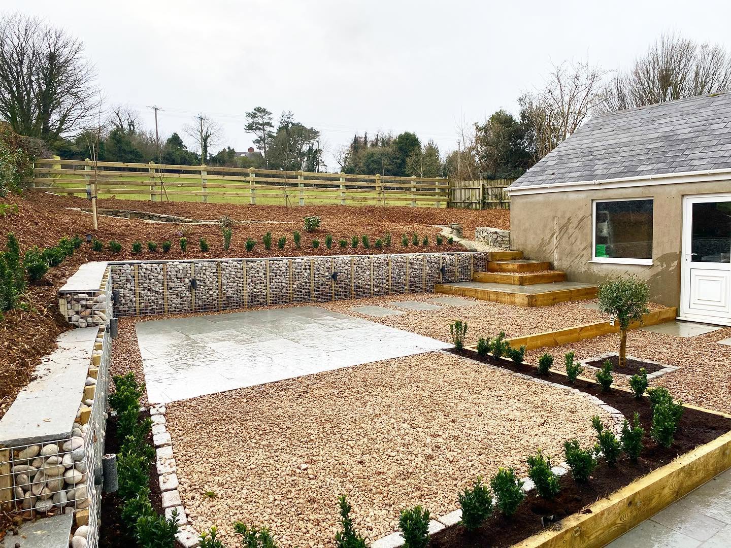 New lawn, pergola and paved patio at a new-build home
